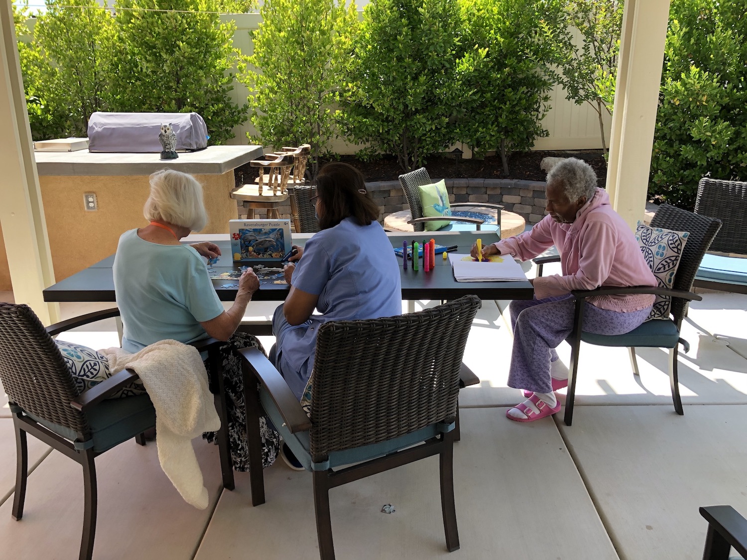 Residents working on art projects outside